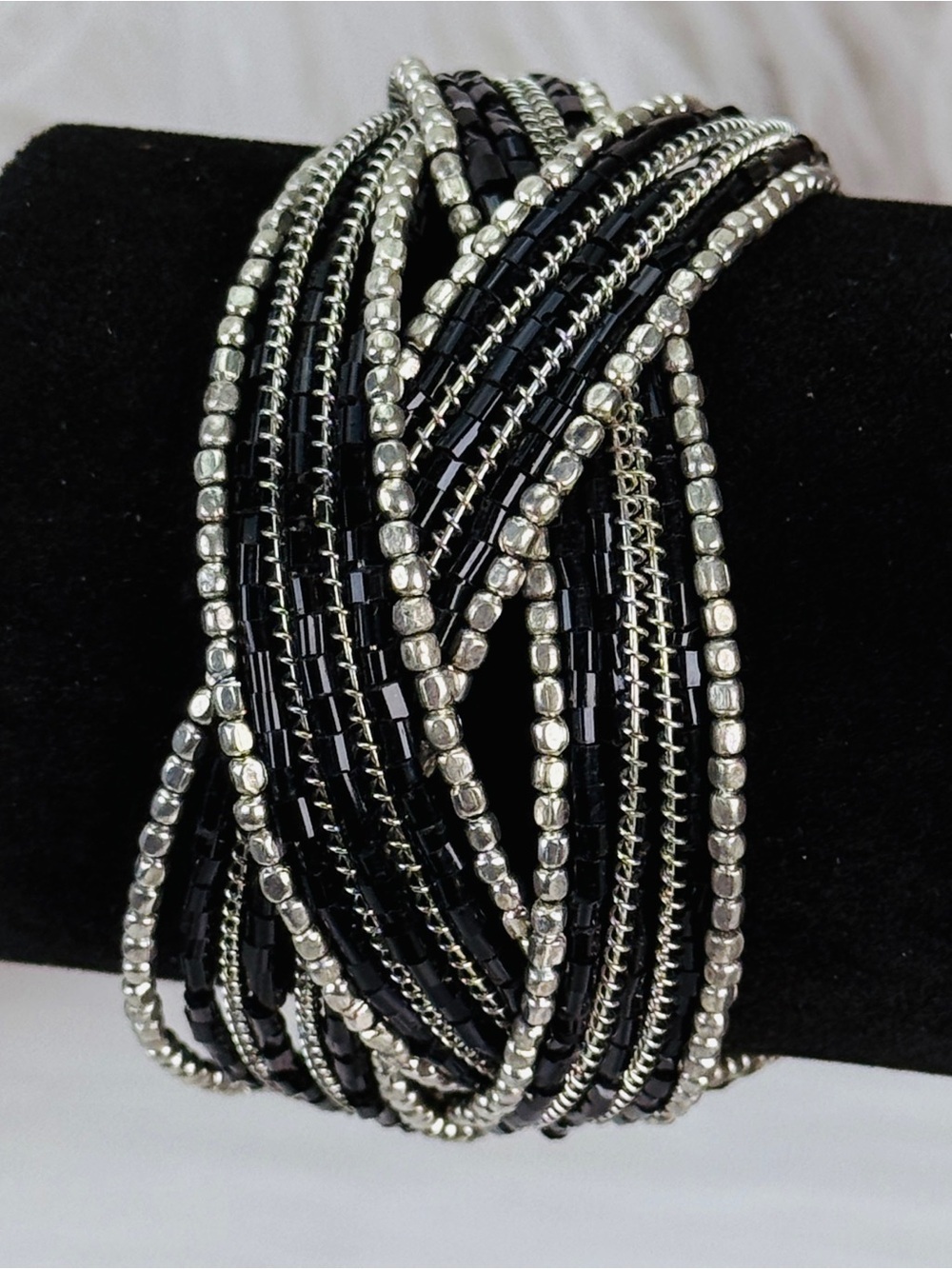 Black and Silvertone braided, bendable costume cuff wide band bra bracelet